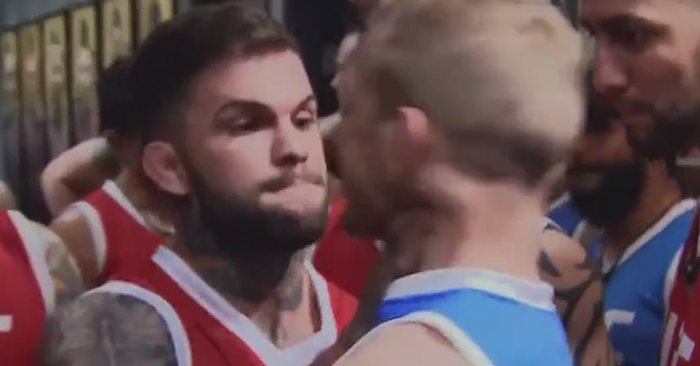 Cody Garbrandt with his hands around the snakes throat, T.J. Dillashaw.