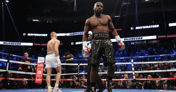 Floyd Mayweather in the ring with Conor McGregor