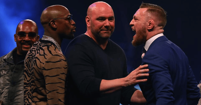 UFC President Dana White tries to keep Conor McGregor under control while face to face with Floyd Mayweather.