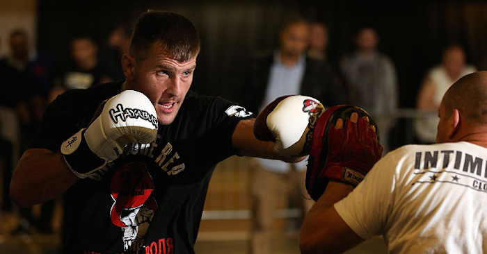 Stipe Miocic waring up on the pads