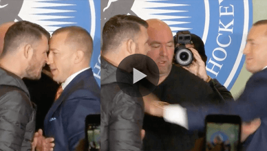 Former UFC welterweight champion Georges. St. Pierre and UFC middleweight champion Michael Bisping get physical during their staredown in Toronto.