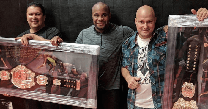 UFC light heavyweight champion Daniel Cormier said thank you to his longtime AKA coaches Javier Mendez and Bob Cook by giving them his UFC belts.