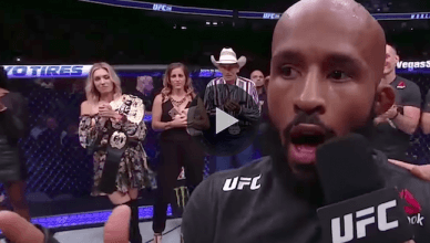 UFC flyweight champion Demetrious Johnson reacts to breaking UFC legend Anderson Silva's title defense record at UFC 216.