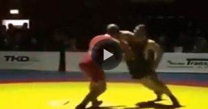 Wrestling KO during a match after a frustrated wrestler throws an elbow and knocks out his opponent.