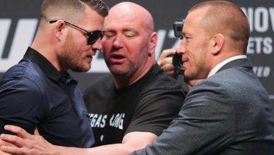 UFC middleweight champion Michael Bisping reacts to former welterweight champ Georges St-Pierre getting physical with him.
