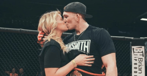 UFC strawweight star Paige VanZant was cageside to give her new man a big congratulatory kiss after his big win this past weekend.