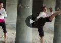 Female Muay Thai practitioner's kicking routine.